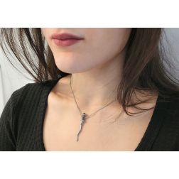 Photo of worn Necklace with Kriss Dagger Pendant with Blue Sapphires and Diamonds