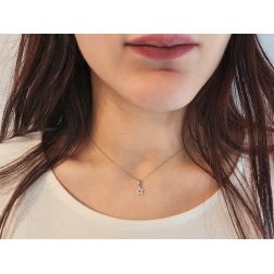 Photo of worn Small perforated star pendant in white gold