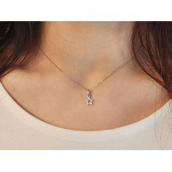 Photo of worn Small perforated star pendant in white gold