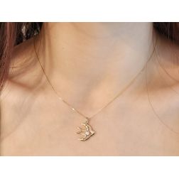 Swallow with zircon in 18kt yellow gold