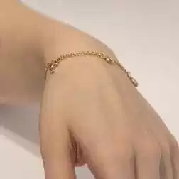 Bracciale 7 ciondoli 3 Lune 2 Cuori 2 Stelle in Tre Colori foto indossata