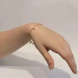 Bracciale 7 ciondoli 4 Lune 2 Stelle 1 Cuore in Tre Colori foto indossata