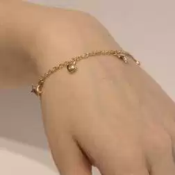 Bracciale 7 ciondoli 3 Stelle 2 Lune 2 Cuori in Tre Colori foto indossata