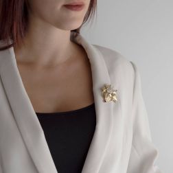 Photo of worn Vase Brooch with Ruby and Diamonds in Yellow and White Gold