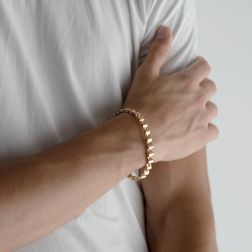Photo of worn Semi-rigid bracelet with Wavy Wellow and Rose Gold segments
