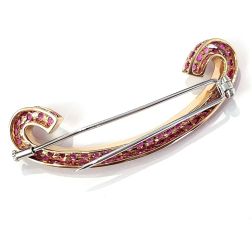 C-shaped Brooch with 69 Rubies in Yellow gold