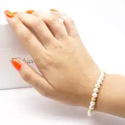 photo of worn Bracelet Pearls 2 x 2 yellow gold