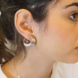 Photo of worn Oval hoops satin-finisched in white gold