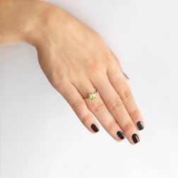 Photo of worn Solitaire Ring with Peridot 7mm x 5mm and 2 Diamonds White Gold