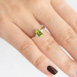 Photo of worn Solitaire Ring with Peridot 7mm x 5mm and 2 Diamonds White Gold