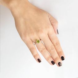 Photo of worn Solitaire Ring with Peridot 8mm x 6mm and 2 Diamonds White Gold