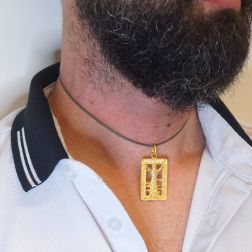 Photo of worn Christ of the Deep yellow gold medal