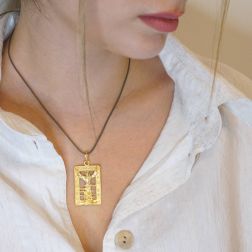 Photo of worn Christ of the Deep yellow gold medal