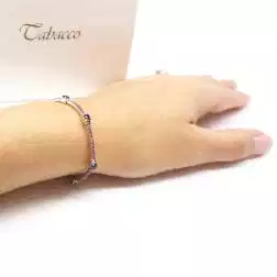 Photo of worn Blue and Pink Sapphire Tennis Bracelet