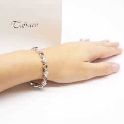 Photo of worn Tennis Bracelet Multicolor Gems and Diamonds