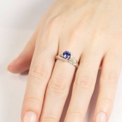 Photo of worn Staggered Solitaire with 5.5 mm Tanzanite and 30 Diamonds