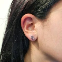 Photo of worn Double Heart shaped earrings 18kt white gold