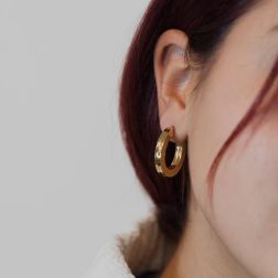 photo of worn Oval Striped squared Hoops 2.60cm x 2.18cm 18kt Yellow Gold