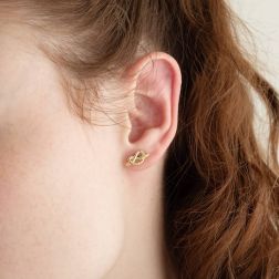 photo of worn Yellow gold knot earring