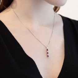 Photo of worn Trilogy Rubies and Diamonds Pendant