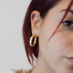 photo of worn 18kt Yellow Gold Satin Hollowed Oval Hoops