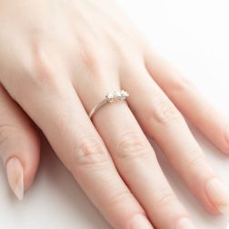 Photo of worn Trilogy Ring Cross Vault 0,30ct