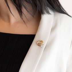 photo of worn 3-color intertwined circles brooch in 18kt gold