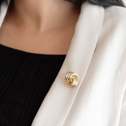 photo of worn 3+3 crossed circles brooch in 3 colors in 18kt gold