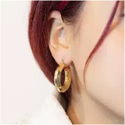 photo of worn Yellow Gold 2,85cm x 6,4mm Hoop Earrings with Grooved Arrow Shape and striped side