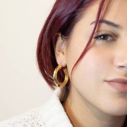 photo of worn Yellow Gold 3,4cm x 6,45mm Hoop Earrings with Grooved Arrow Shape and striped side