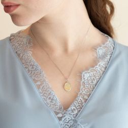 Photo of worn Two-tone thinking Angel oval medal