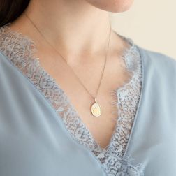 Photo of worn Two-tone thinking Angel oval medal