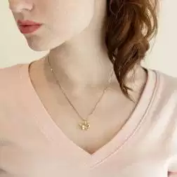 Photo of worn Butterfly Charm in 18kt yellow gold boxed structure