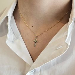 photo of worn Cross pendant with X on the center and grooves on the edges  in Yellow Gold