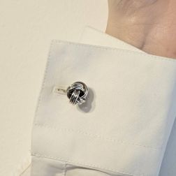 photo of worn Interlacement cufflinks in 18kt white gold