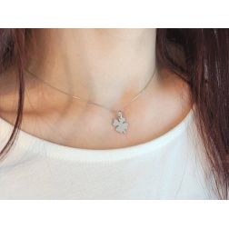 Photo of worn Four Leaf Clover with Stem Medal Pendant in White Gold