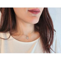 Photo of worn Four Leaf Clover with Stem Medal Pendant in White Gold
