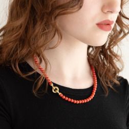 photo of worn Coral necklace round clasp in Yellow Gold