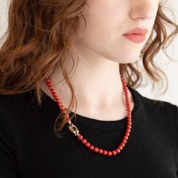 photo of worn Coral rectangle clasp necklace in Yellow Gold