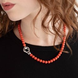 photo of worn C clasp Necklace in Coral and White Gold