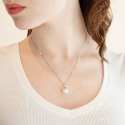 Photo of worn Freshwater pearl drop pendant embracing