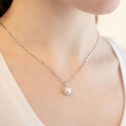 Photo of worn Freshwater pearl and cubic zirconia circle pendant