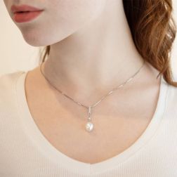 Photo of worn Freshwater oval pearl and cubic zirconia pendant