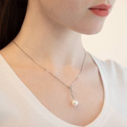 Photo of worn Freshwater oval pearl and cubic zirconia pendant