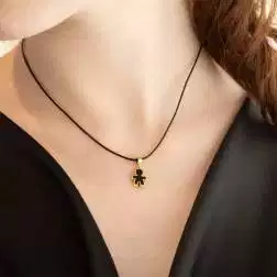 Photo of worn Pendant Synthesis Enamel Baby black on yellow gold