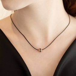 Photo of worn Perforated Hearts Sphere Pendant