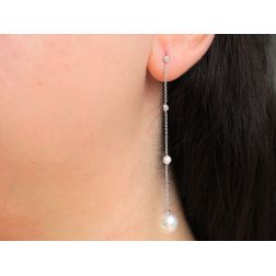 Photo of worn Point of Light and Akoya Pearl Pendant Earrings
