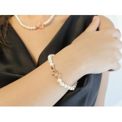 photo of worn Fresh Water pearls bracelet with 18kt Rose Gold Flower clasp