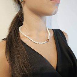 photo of worn Fresh Water Pearls necklace with 18kt Rose Gold rounded flower clasp