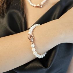 photo of worn Fresh Water pearls bracelet with 18kt Rose Gold rounded flower clasp